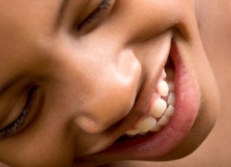 Close up of a girl smiling.