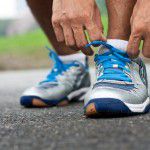 Man tying running shoes