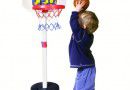 Boy playing with basketball hoop